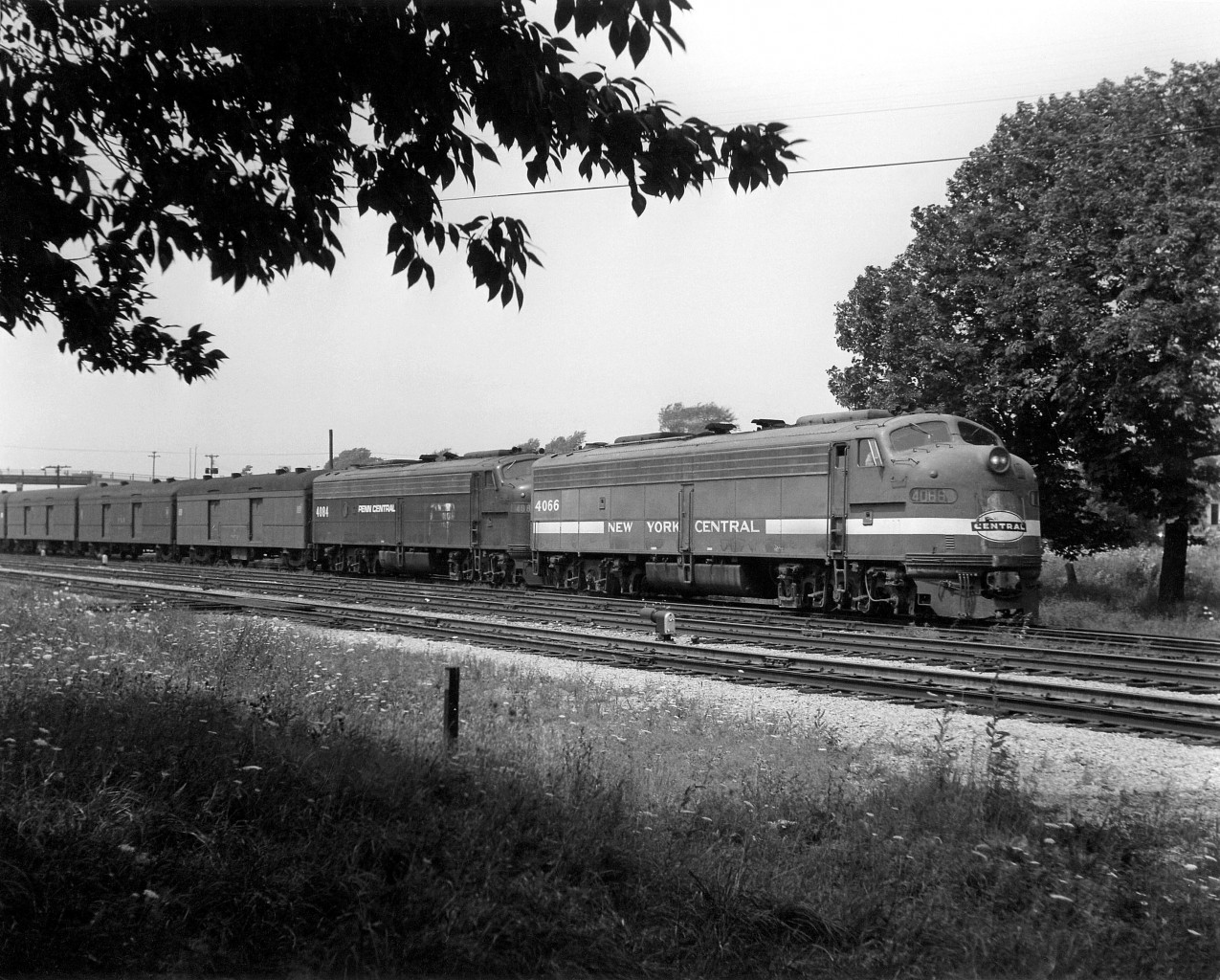 Penn Central was a little over 2 years old now, and here we find New York Central E8 4066 still in its previous owner's colours, with PC E8 4084 trailing, on a passenger train stopped at the station in Fort Erie ON before crossing the International Bridge into Buffalo NY.
