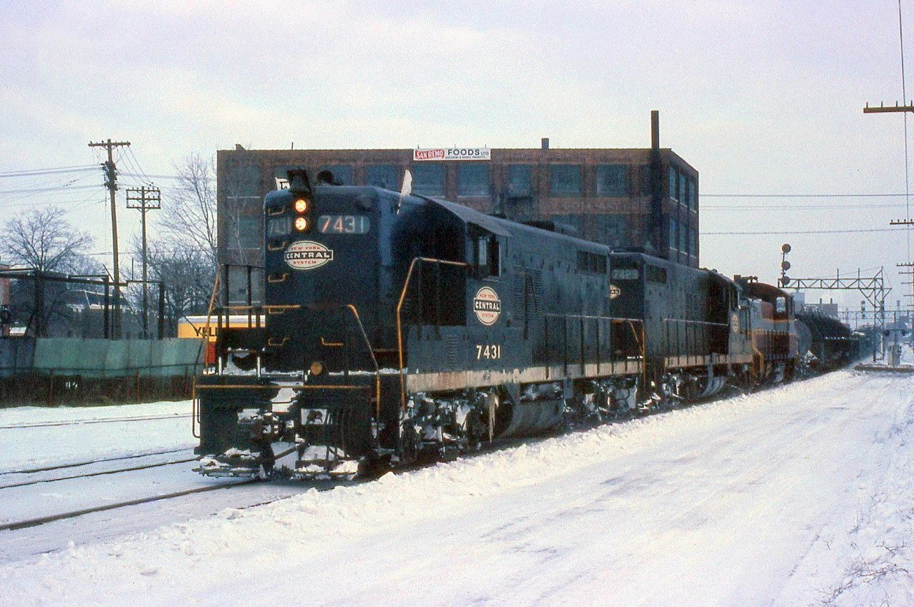 Sometimes New York Central power (and later Penn Central) found its way onto the Canadian Pacific, either through run-through, borrowed or pooled power arrangements. Here, a pair of Canadian-built CASO-assigned NYC GP9's (7431 and 7429, still in NYC colours despite the Penn Central merger 4 years previous) team up with a CP SW1200RS, heading a CP freight westbound through West Toronto junction enroute to Buffalo.
