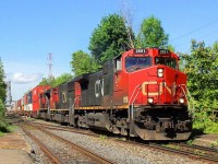 Coming out of Victoria Bridge passing on top of a old viaduc CN-2691 a EF-644-F leading loco with CN-5494 a GF-643-A  and CN-8024 a SD-70-M2 all 3 pulling over 11,000 feets of containers cars going to the maritimes and more of the half of containers going oversea