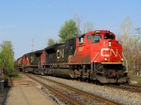 CN-8867 a SD-70M2 leading loco with CN2579 a C-44-9W crossing from South main track to North main track pulling a covoy of Covered hopper cars with wheat going in Halifax NS after Russia according CN employé