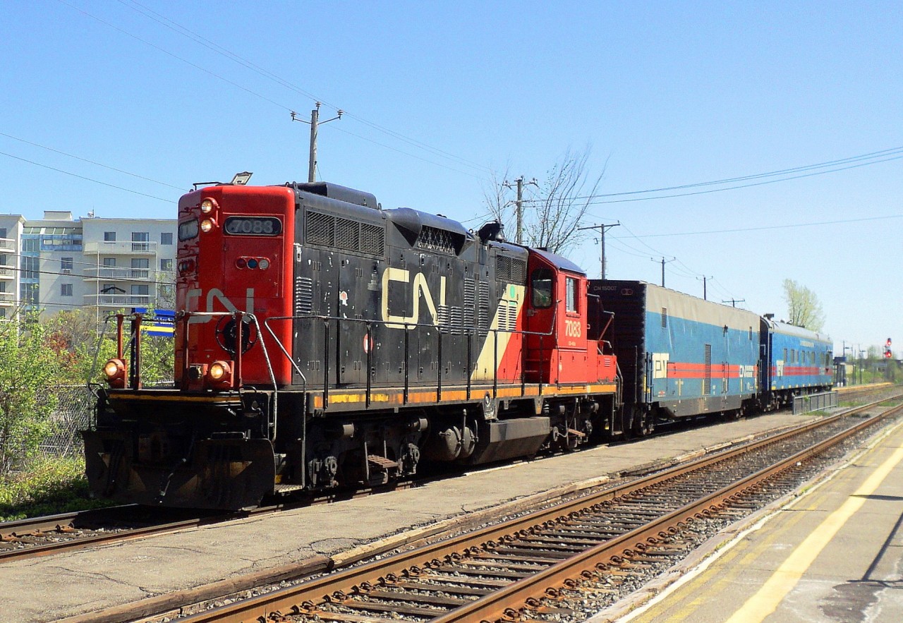 CN-7083 a GS-418d pulling 2 CN car one CN engineering car and a car CN Track evaluation system
