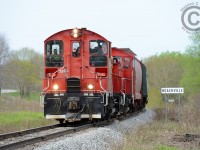 A pair of pups round the curve 1 mile from Beachville, Ontario headed to Woodstock.