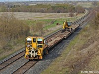 Tearing along the Kingston Sub at a whopping 13mph, maybe a little faster, they 'notched her out' as they passed by, OTHX 22 leads three flats through the Newtonville Sag. Reminds me of the Ecorail... except the Trackmobile wasn't dead and being towed by a locomotive. 1732hrs.