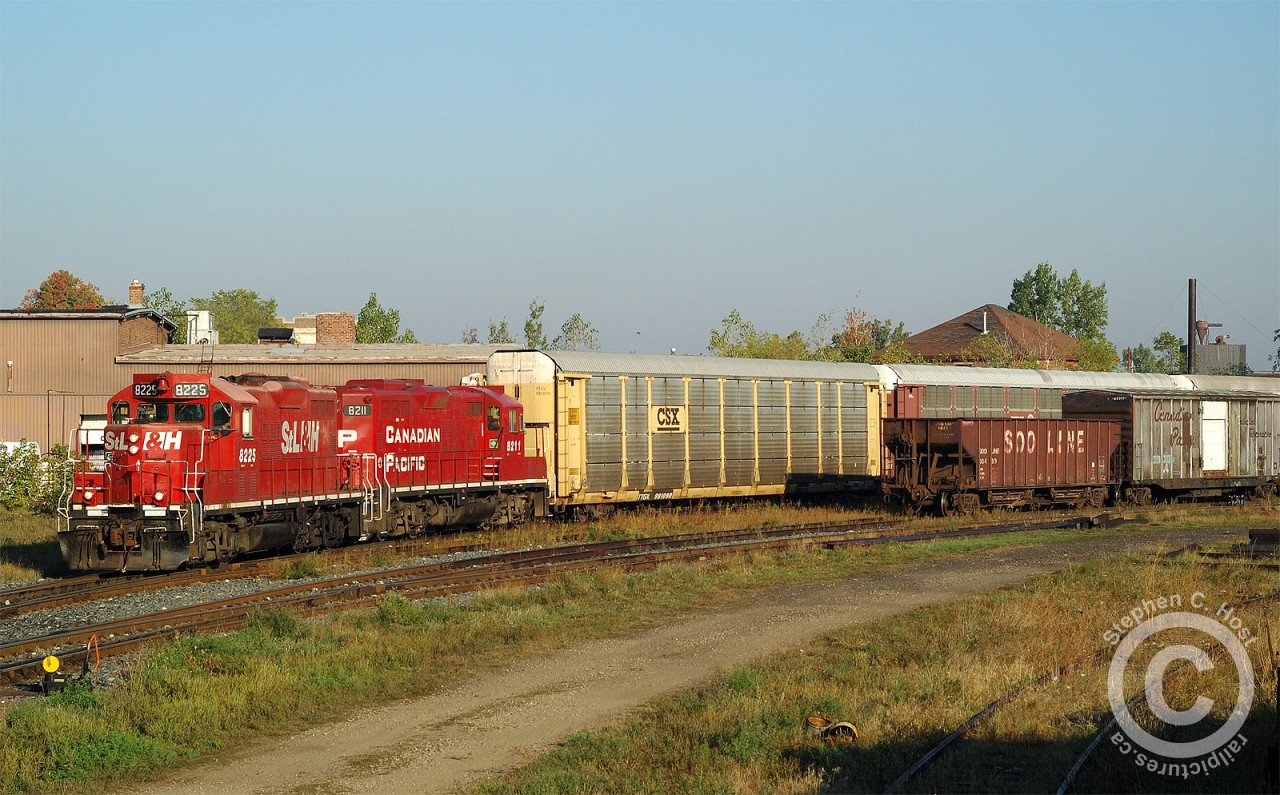 A nice pair of clean 8200's power the London Division's Ham Turn (London to Hamilton and return). A daylight eastbound run of the Ham turn was quite rare. Most 'fans would normally remember the Ham Turn as a daylight westward light power run to London, but this photo illustrates the reason why the Ham Turn existed - connecting Toyota loaded autos to Hamilton (for Buffalo). Without the Toyota traffic, the Ham Turn would not have existed.

Six CPR trains daily worked the extensive Galt yard trackage - almost every foot of available track was stuffed with loaded or empty autotracks at times and it took a lot of movements to keep traffic flowing. Wolverton Yard has made much of this track redundant and the electric yard at right was removed in the last two months. The times may have changed on the CPR but it's still busy in Galt!
