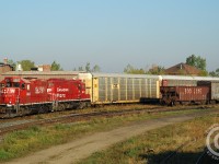 A nice pair of clean 8200's power the London Division's Ham Turn (London to Hamilton and return). A daylight eastbound run of the Ham turn was quite rare. Most 'fans would normally remember the Ham Turn as a daylight westward light power run to London, but this photo illustrates the reason why the Ham Turn existed - connecting Toyota loaded autos to Hamilton (for Buffalo). Without the Toyota traffic, the Ham Turn would not have existed.
<br><br>
Six CPR trains daily worked the extensive Galt yard trackage - almost every foot of available track was stuffed with loaded or empty autotracks at times and it took a lot of movements to keep traffic flowing. Wolverton Yard has made much of this track redundant and the electric yard at right was removed in the last two months. The times may have changed on the CPR but it's still busy in Galt!
