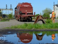 A scene that follows nicely to Arnolds photo at Paris Junction in the 70's <a href=http://www.railpictures.ca/?attachment_id=14613>(see here) </a> I present the above image which I happened upon on Sunday morning.<br><br>
The conductor on CN 580 is looking attentively at the moement, he's calling it in feet and they move very slowly due to the irregularities found on track DF42 and DF40 beside him - frogs missing and clearly lots of rust, these tracks rarely see any service. DF33 pictured here, functions as the Paris wye's east tail (and for some setoffs) and is the remains of the former St. George sub - removed after the Brantford Cutoff was built around 1900-1930.<br><br>
I'm led to believe this car was set-off for a wheel replacement, and needs to be accessibly by rubber tire mounted crane.