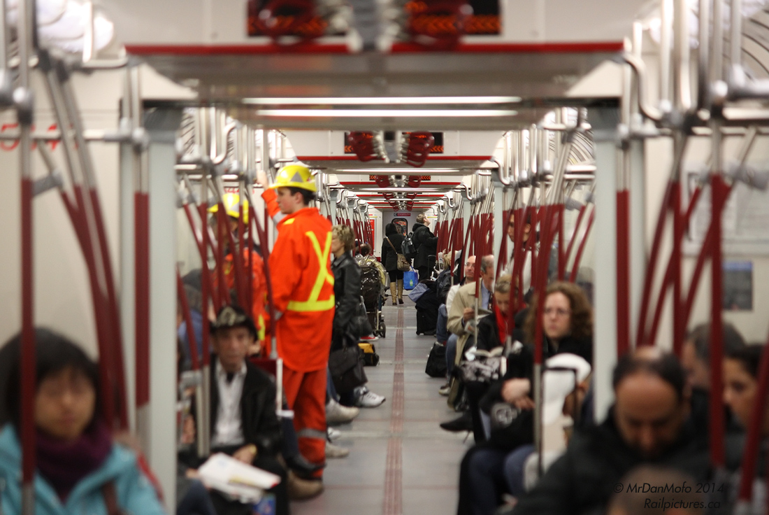 Vanishing Point

Looking down the full six-car length interior of a brand new Toronto Rocket subway train, loaded and ready to depart Toronto Union Station up the Yonge line.