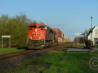 CN Intermodal hotshot 148 passes through Wyoming Ontario - one of the smaller, diminutive towns on the Strathroy Subdivision. VIA does service this small station, but you must reserve in advance, no flag stop permitted here.