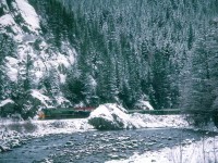 Southbound train #12 rolls through the Cheekaukmus Creek Canyon near Garibaldi, British Columbia in January of 1990.