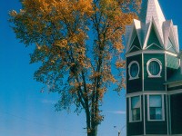 CDAC 905 gets underway after a crew change at Lac-Megantic, Quebec in October of 1997. The house in the forground just escaped the devestation of the MM and A run away oil train derailment of July 6, 2013. Everything, and I mean everything to the right of this home and the third locomotive is gone from the blast of the oil tank cars.