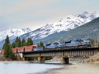 During a (VERY) brief period of sunlight (bright cloud if you will), 2 of CN's 4 recently acquired EMD SD70ACes (8101 and 8102) speed across the Fraser River at Redpass, BC with Vancouver-Winnipeg train M302.