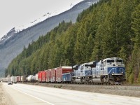 With a set of grain empties stopped a few miles ahead at Grant Brook, a pair of CN's quartet of ex. EMDX SD70ACe demonstrators coast towards their tail end to wait for a few westbounds.