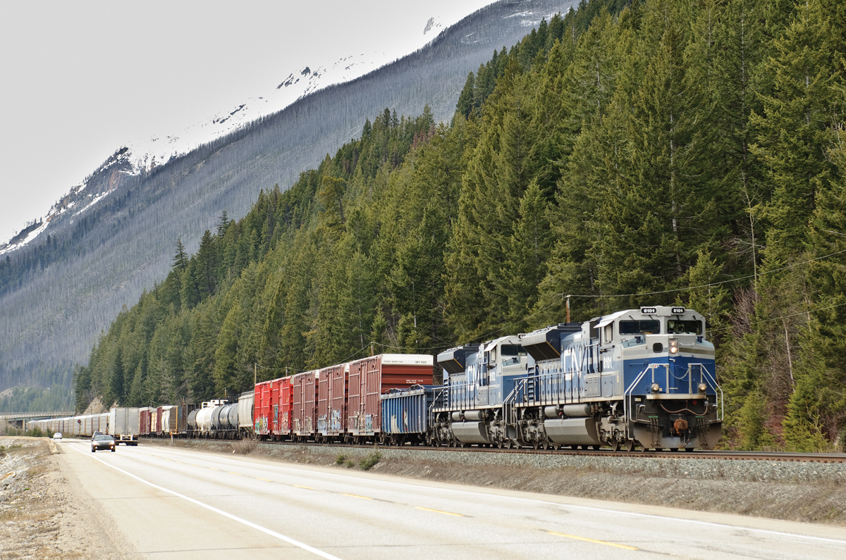 With a set of grain empties stopped a few miles ahead at Grant Brook, a pair of CN's quartet of ex. EMDX SD70ACe demonstrators coast towards their tail end to wait for a few westbounds.