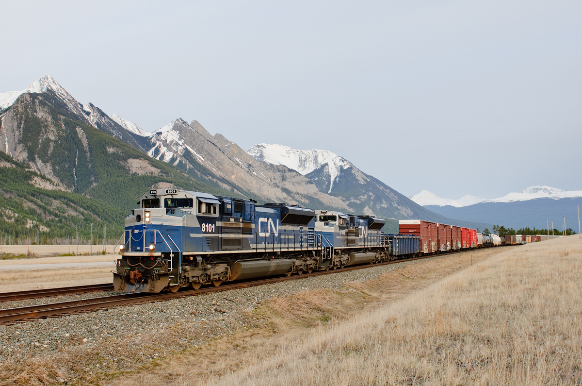 Former EMDX SD70ACe-P6's 1208 and 1209 now wearing different numbers for CN bring Vancouver, BC - Winnipeg, MB train M302 to a stop at Henry House for a meet with two westbounds.