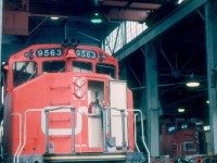 A CN employee granted this quick shot peering into the engine house on a Sunday morning at Hamilton, Ontario in July of 1986.