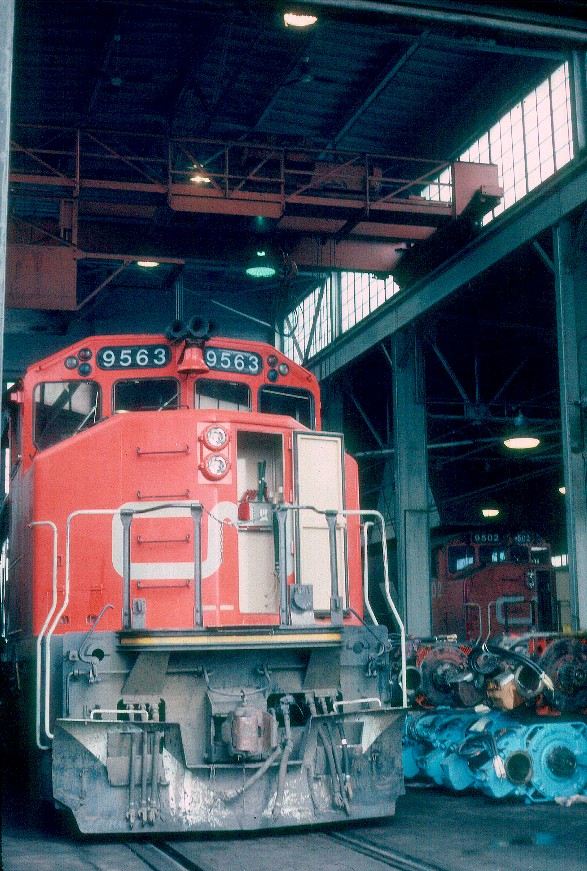 A CN employee granted this quick shot peering into the engine house on a Sunday morning at Hamilton, Ontario in July of 1986.
