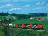 CNR 394 is just below Waterville, Quebec in August of 1987 hustling south toward the US border.