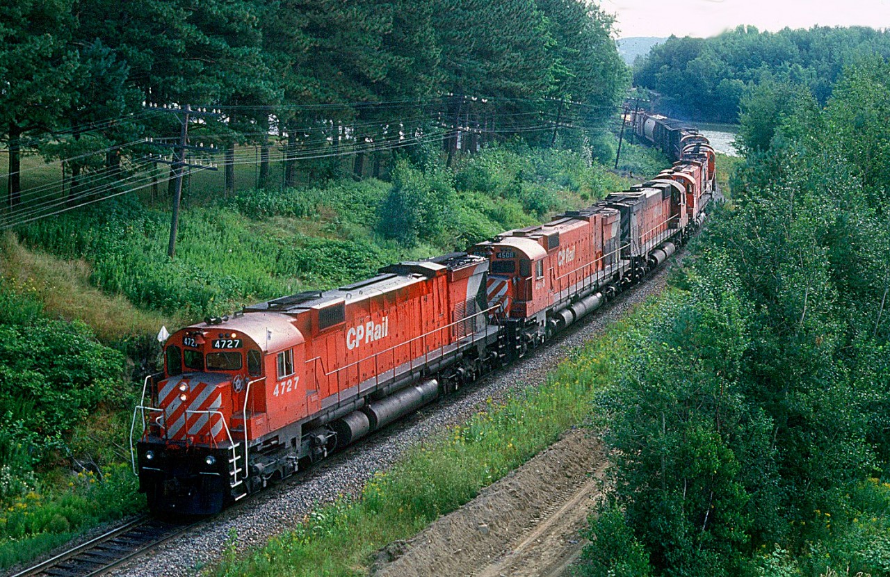 Count'em. Seven. Yup, seven MLW's up front on this extra westbound at Sherbrooke, Quebec. I'm pretty sure just the first four are on line because it is a rule that no more than 24 operating axles were to power the freights on the eastern lines of the CPR however, it was an unwritten rule that if tonnage was heavey sometimes some of those trailing units would suddenly come to life and get over the road when needed....;)