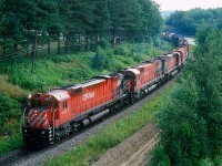 Count'em. Seven. Yup, seven MLW's up front on this extra westbound at Sherbrooke, Quebec. I'm pretty sure just the first four are on line because it is a rule that no more than 24 operating axles were to power the freights on the eastern lines of the CPR however, it was an unwritten rule that if tonnage was heavey sometimes some of those trailing units would suddenly come to life and get over the road when needed....;)