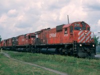 CPR Extra 4739 east rolls into Sherbrooke, Quebec in August of 1987 with 7 other units trailing behind her, including 2 Chessie GP40 lease units.