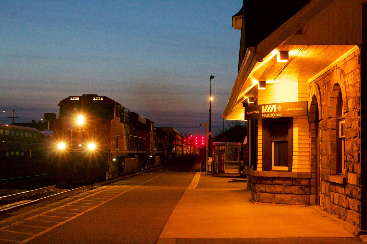 Three Erie built GE's roll past the old VIA/GO station at Georgetown during the last minutes of the so called "Blue Hour"