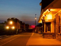 Three Erie built GE's roll past the old VIA/GO station at Georgetown during the last minutes of the so called "Blue Hour"