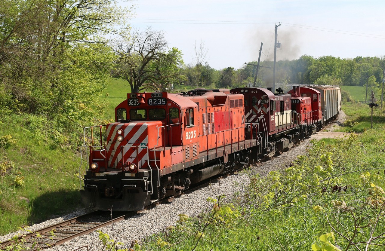 OSRX GP9u 8235 is back on home rails after spending most of the winter leased to power short Goderich-Exeter RR. It accompanies two other former CP units as they head their train north to Guelph with traffic destined for the Guelph north spurs.