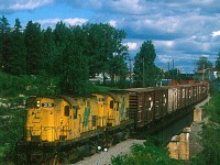 Two R&S Alco C420's roll east through Chitcoutimi, Quebec on a gorgous evening in August of 1988.
