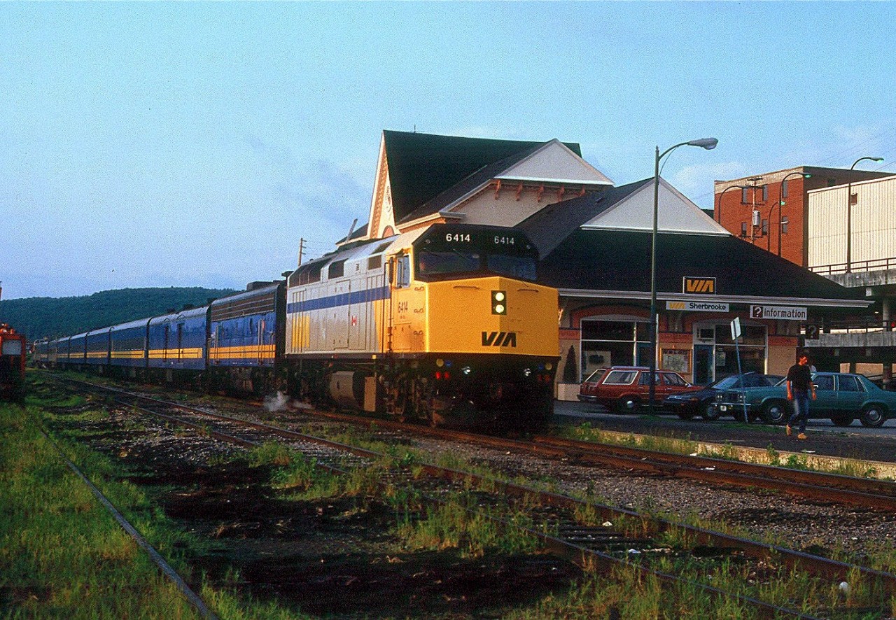 It's a fine June morning in 1987 at Sherbrooke, Quebec. VIA's "Atlantic" westbound has just arrived, on time, at 5:59AM.