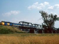 An ex CN FP9 crosses the Laurier Railway Bridge at Rivière-des-Prairies–Pointe-aux-Trembles just north of Montreal, Quebec in August of 1989. 