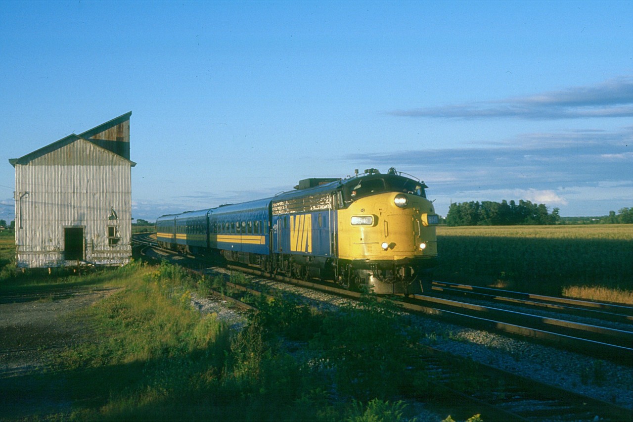 VIA's "Frontenac" is eastbound at Saint-Germain-de-Grantham, Quebec in early evening on a wonderful August day in 1987.
