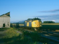 VIA's "Frontenac" is eastbound at Saint-Germain-de-Grantham, Quebec in early evening on a wonderful August day in 1987.