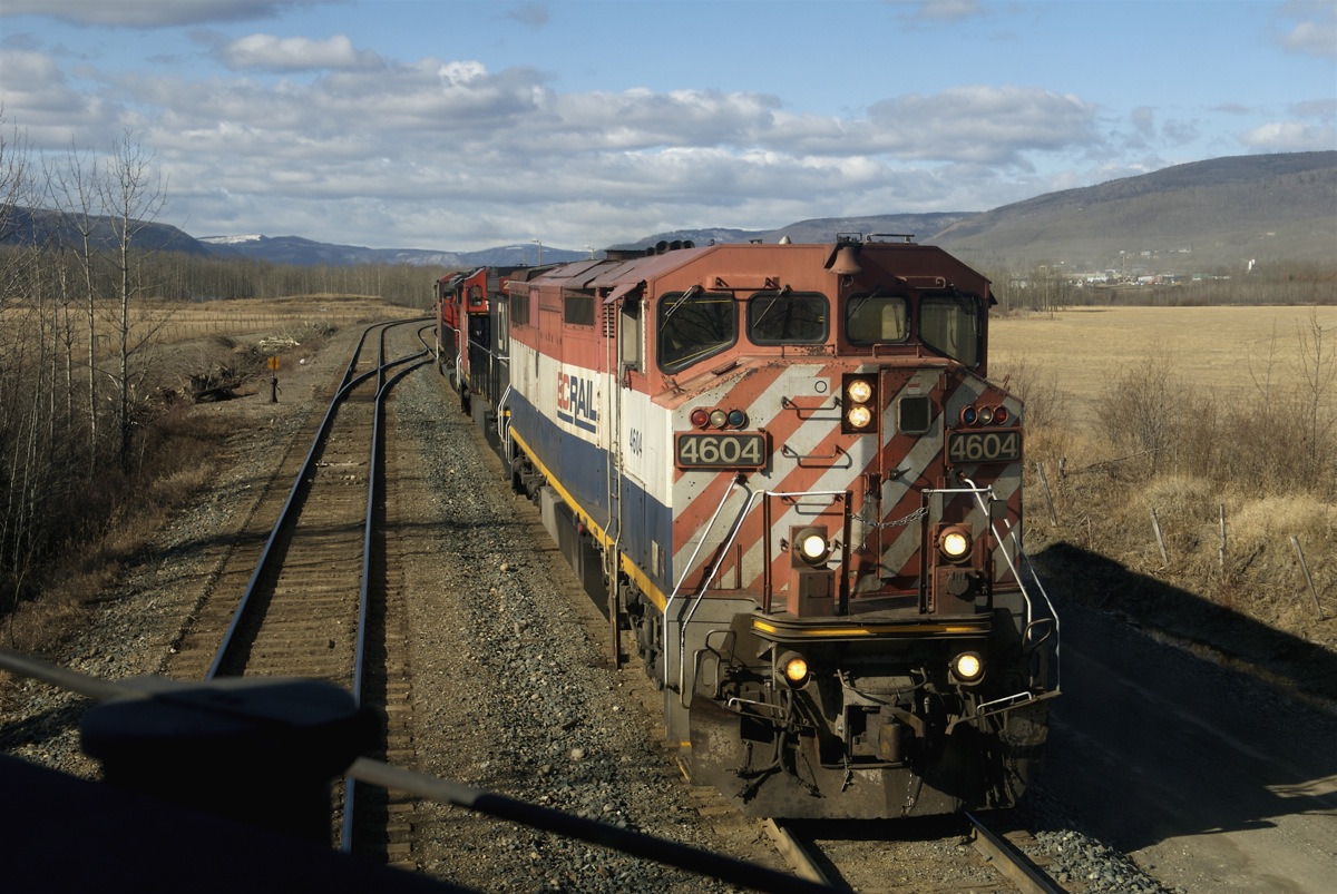 The 0400 switcher's power waits clear of the crossovers for the 575 to yard its train.