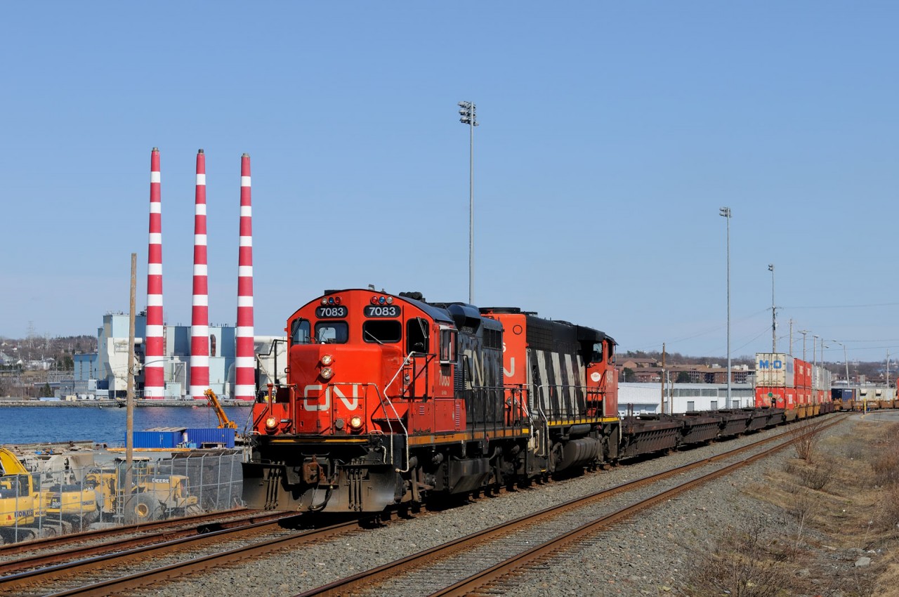 No shortage of intermodal yards in Halifax! The iconic Tuft's Cove Generation Station smokestacks can be seen across the narrows.