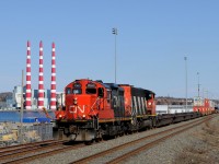No shortage of intermodal yards in Halifax! The iconic Tuft's Cove Generation Station smokestacks can be seen across the narrows.