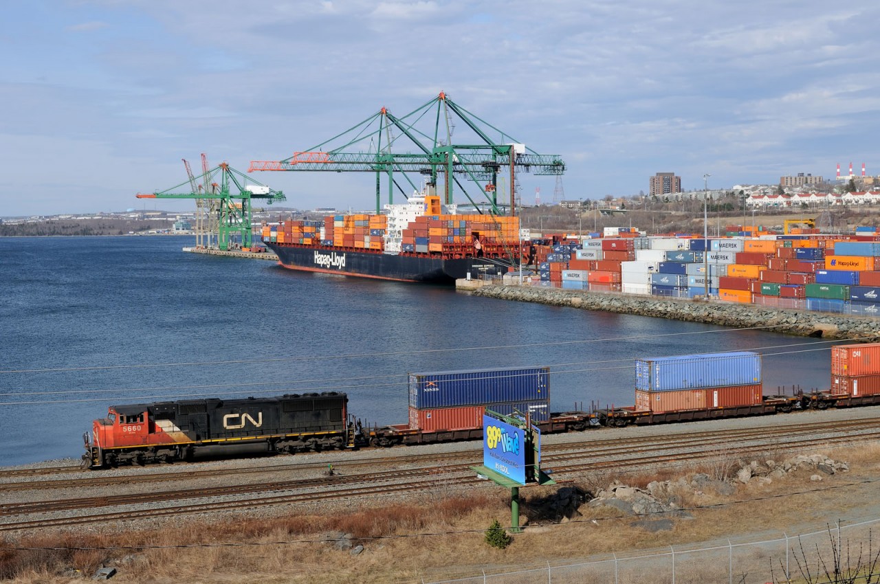 CN 5660 shuffles containers at the Fairview Cove Container Terminal as Hapag-Lloyd's Dresden Express is unloaded in the background.