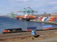 CN 5660 shuffles containers at the Fairview Cove Container Terminal as Hapag-Lloyd's Dresden Express is unloaded in the background.