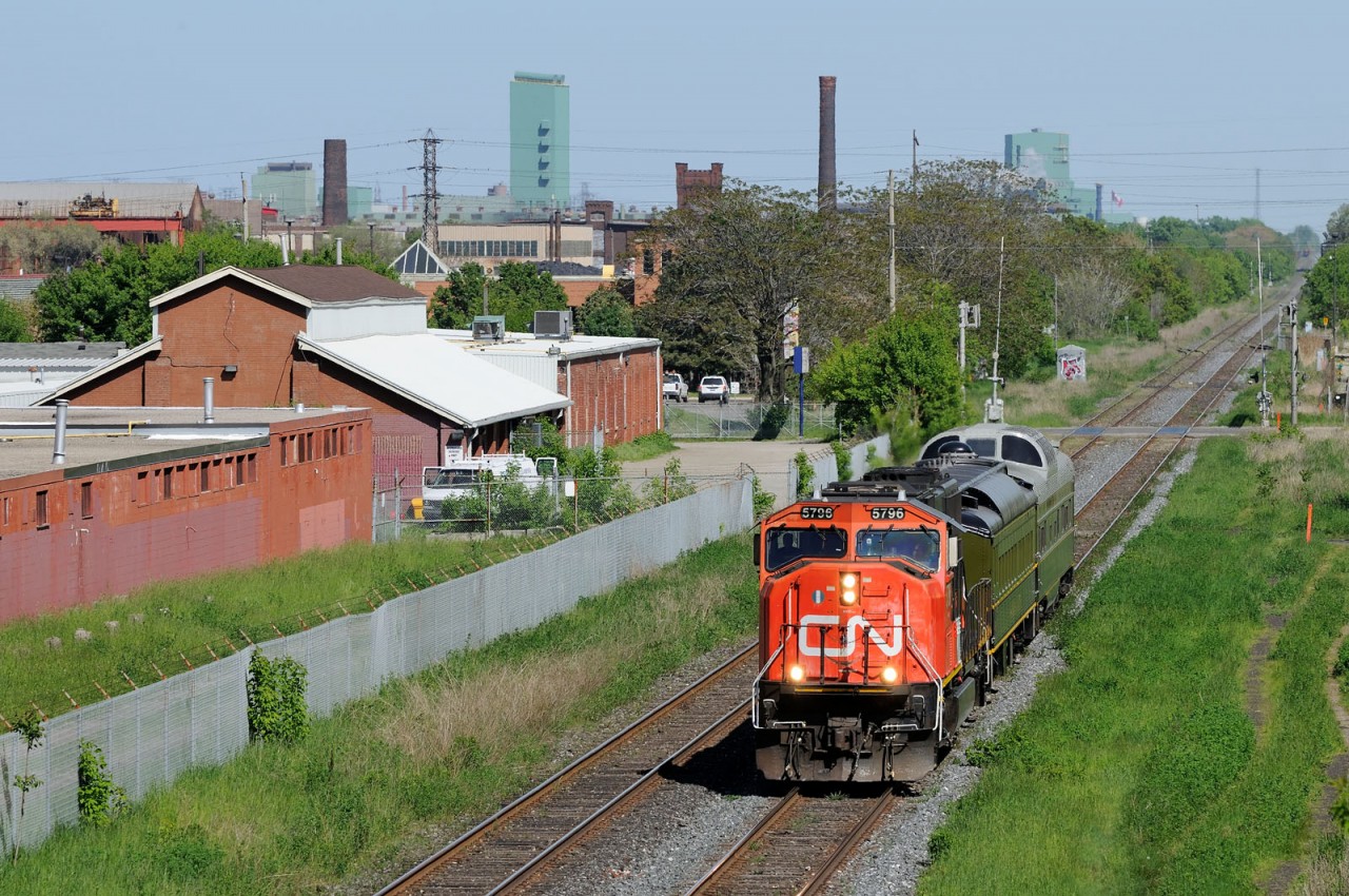 CN P004 rolls through Hamilton with a train carrying local politicians and CN brass.