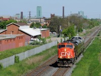 CN P004 rolls through Hamilton with a train carrying local politicians and CN brass.