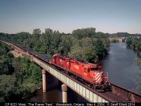The empty "Frame Train" rolls over the Thames River in Woodstock, Ontario on May 4, 2004 as it heads back to St. Thomas to get another load of frames for the GM plant in Oshawa.  This shot wasn't planned as we were actually waiting for the CP Executive train, but I'll take it anyway.  Can't beat a pair of GP9's on a train....