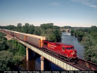 CP 8544 works as a 'lone gun' on a westbound autorack train as it rolls over the Thames River, just north of Woodstock, Ontario on June 4th, 2004.  This wasn't what we were here for, as we were waiting of the CP Exec train with 1401 on the point which came later, but this shot was worth the wait as well.