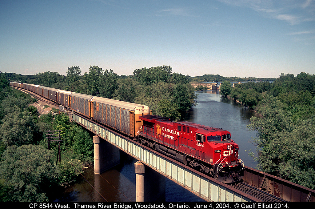 CP 8544 works as a 'lone gun' on a westbound autorack train as it rolls over the Thames River, just north of Woodstock, Ontario on June 4th, 2004.  This wasn't what we were here for, as we were waiting of the CP Exec train with 1401 on the point which came later, but this shot was worth the wait as well.