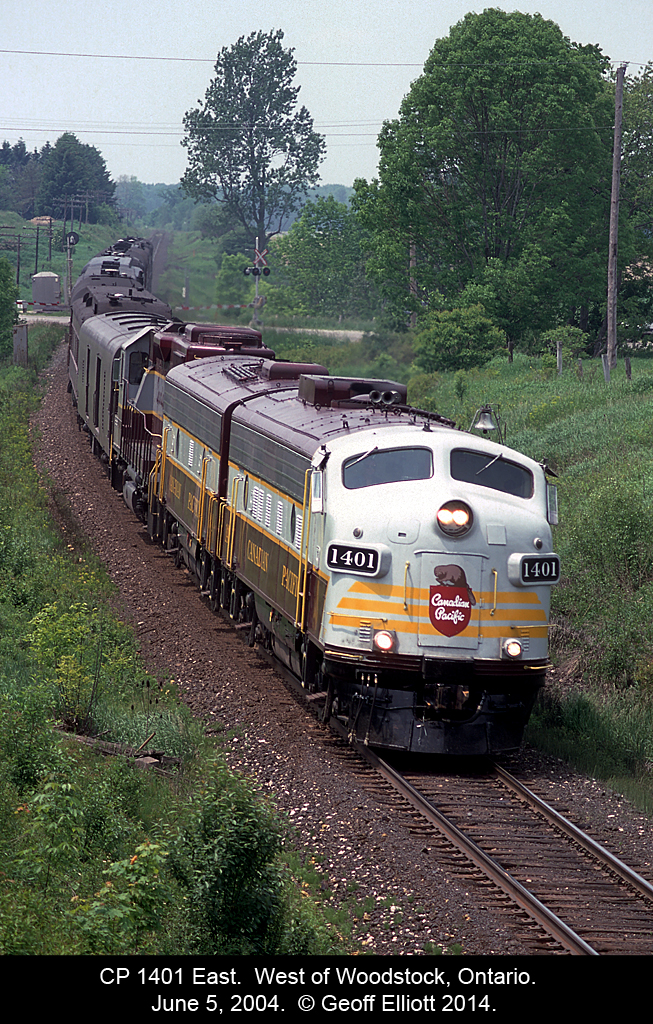 Just west of Woodstock we have CP 1401 crossing #2 Hwy in the background.  The poor farmer that lives on this drive must have been wondering "WTF" was going on when he saw dozens of Railfans up on the bridge shooting this train as it went by.....  There was 'foam' everywhere!!