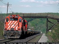 The westbound empty frame train speeds up the grade while heading back to St. Thomas, Ontario after delivering loaded flats of frames to GM in Oshawa.