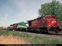 CP 8538 East has an interesting lashup today as GO Transit MP40PH-3C #633 hitches a ride to Toronto as the train passes over Puce Creek just outside of Puce, Ontario.  Not to be forgotten, also along for the ride is an ICE SD40-2 bringing up the rear pushing those 2 ugly GE's home.  :-)