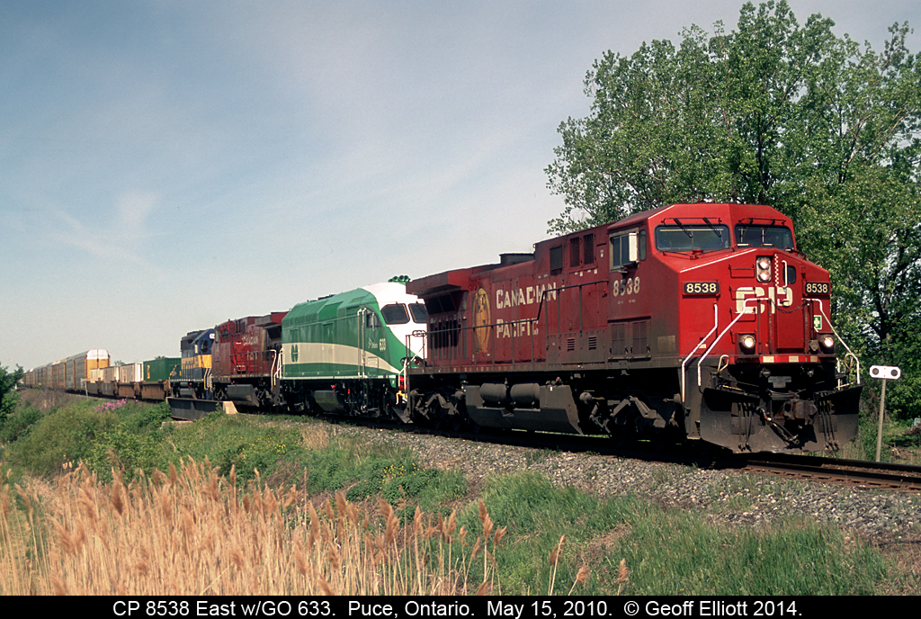 CP 8538 East has an interesting lashup today as GO Transit MP40PH-3C #633 hitches a ride to Toronto as the train passes over Puce Creek just outside of Puce, Ontario.  Not to be forgotten, also along for the ride is an ICE SD40-2 bringing up the rear pushing those 2 ugly GE's home.  :-)