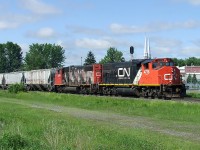 CN 430 with 2 GP-38s,throttle opened wide for the uphill to come at 15 mph.
