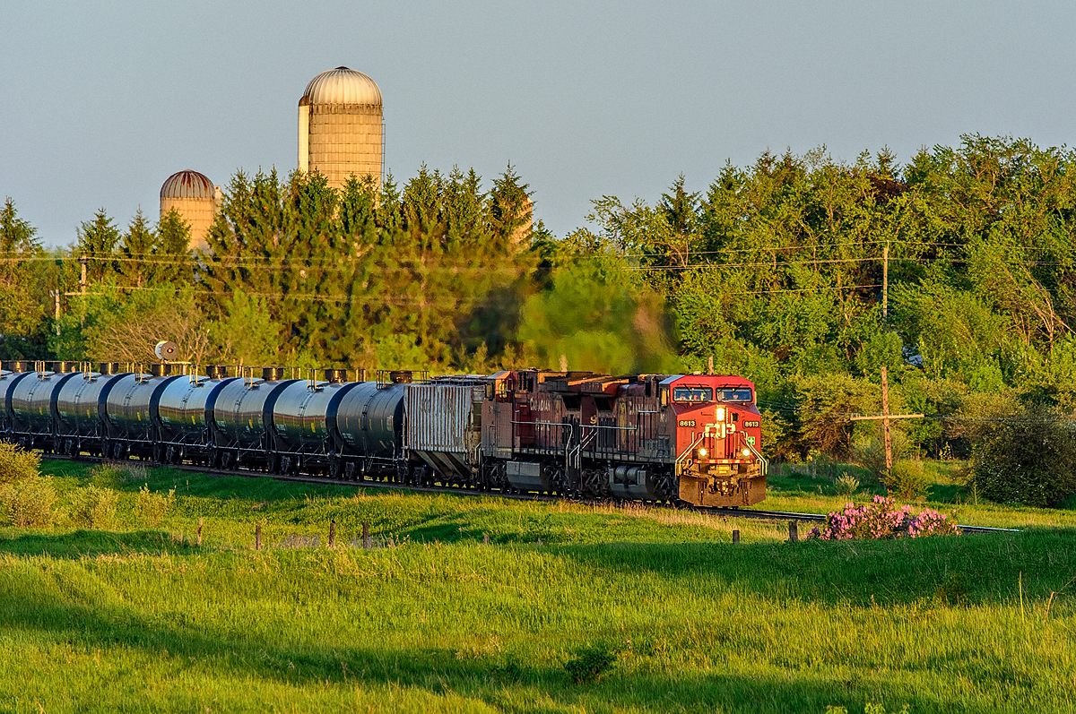 CP 8613 with train 608 approaches Newtonville Road just after sunrise.