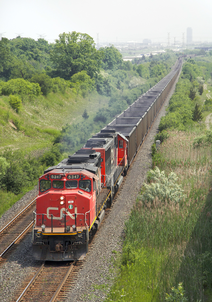Coal in Ontario!

CN train C772 moves swiftly westwards at Humber with very exquisite motive power on hand. #772 is an empty coal train from Kamloops, BC to Seneca, NY...where the B&P will take it to the B&LE.