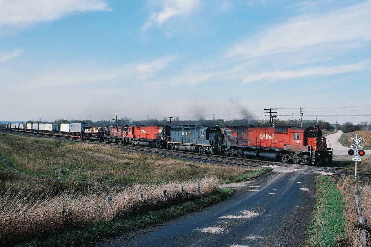 ...Thirty years ago...


...CP Rail was a division of Canadian Pacific Limited (other divisions included CP Hotels, CP Ships, CP Air )


….railway  rights of way were shrubbery free and  tree-less...


...and lash-ups  were commonly  three  or more  units...
 

...Alco (MLW) power...was the norm on CP Rail (Eastern and Atlantic Region) – (all those dozens of  new SD's sent west ),


An eastbound CP Rail   #942  with TOFC at Lovekin,


Powered by Four Units Three Models Two Builders: a  lashup soiled by a single EMD invader:


CP Rail #4569 - B&O 3736 – CP Rail  4509 – CP Rail  4236 ( MLW M630 - EMD GP40 - MLW M630 - MLW C424 )


B&O 3736 off the Chessie  roster by January 1, 1987 but lived to see CSX: By April 30, 1986 B&O merged into the C&O; then July 1, 1986 C&O was merged into the new CSX Transportation (part of the CSX Corporation)


by 1991: 4509 stored unserviceable and  by 1993:  4569 retired  and  4236 is the future 1100
 

Oct 20 1984 Kodachrome by S.Danko


What's interesting: 
 

CP Limited  sold CP Air in 1987 as part of the merger of Nordair and Pacific Western to form  Canadian Airlines


October 3, 2001 Canadian Pacific Limited spin off the remaining Divisions into separate companies and at that time the Canadian Pacific Railway Limited that we know today was created.


CP Hotels acquired the Delta and Princess Hotel chains (in 1998) and Fairmont chain (1999) then  changed name – in October 2001 to Fairmont Hotels and Resorts and in January 2006 Fairmont was acquired by Kingdom Hotels ( Saudi Arabia owned ).


CP Ships Limited ( at that time THE major source of CP Rail's container traffic )  was sold in 2005 to TUI AG (Germany) who merged CP Ships into the Hapag-Lloyd division.



> and the clear view at the Lovekin crossing  today !


  Stephenson Road 2014  


sdfourty